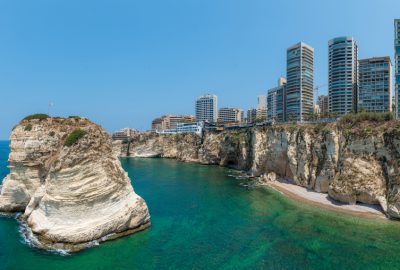 view of Raouch Rocks in the sea and skyscrapers of Beirut