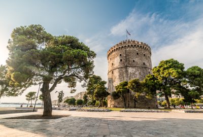 The White Tower in Thessaloniki bordered by trees