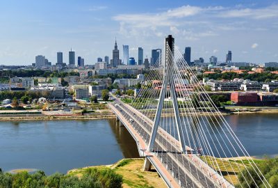 Swietokrzyski Bridge overspanning the Wisła River in Warsaw and city view