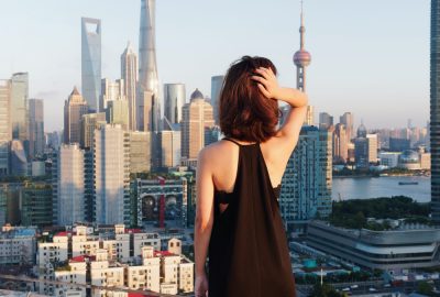Independent escort in Shanghai looking over the city's skyline