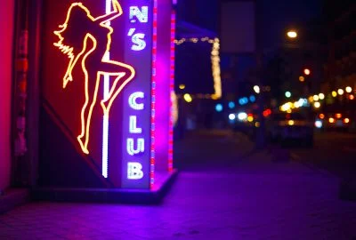 Neon lights advertising striptease show in Dubai