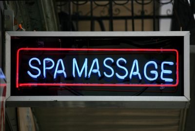 Neon light advertising spa massage in Moscow