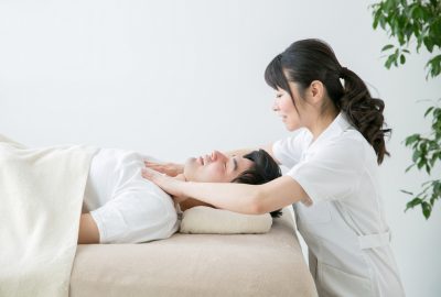 Korean masseuse with client in massage salon in Seoul