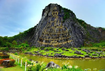 The mountain of Khao Chi Chan near Pattaya with a large golden image of Buddha carved in stone