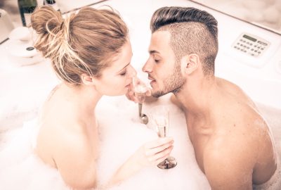 Romantic couple in whirlpool of private swinger club in Torino