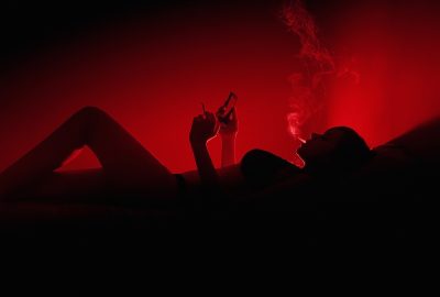 Smoking Utrecht hooker on bed in red light district
